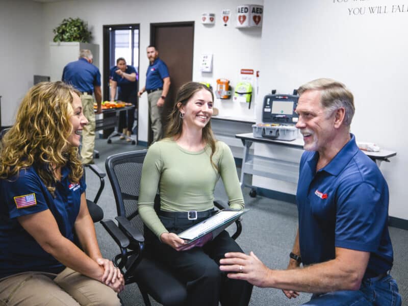 Rescue Training Institute Chloe Foster is congratulated by President Greg Landin for her heroic first aid efforts. 