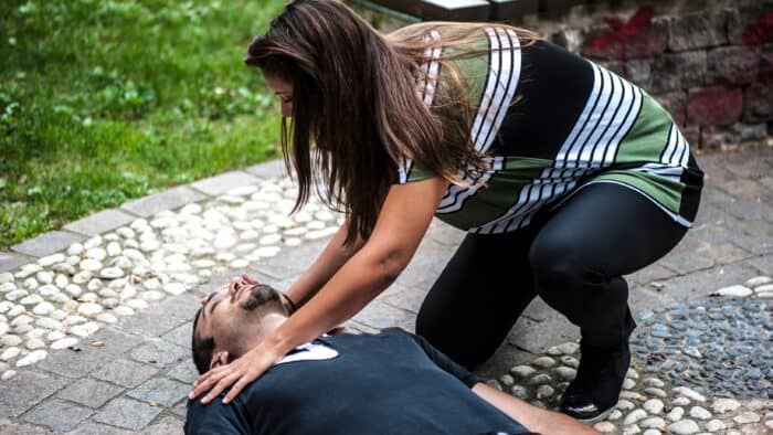 Woman performing CPR, Sacramento California